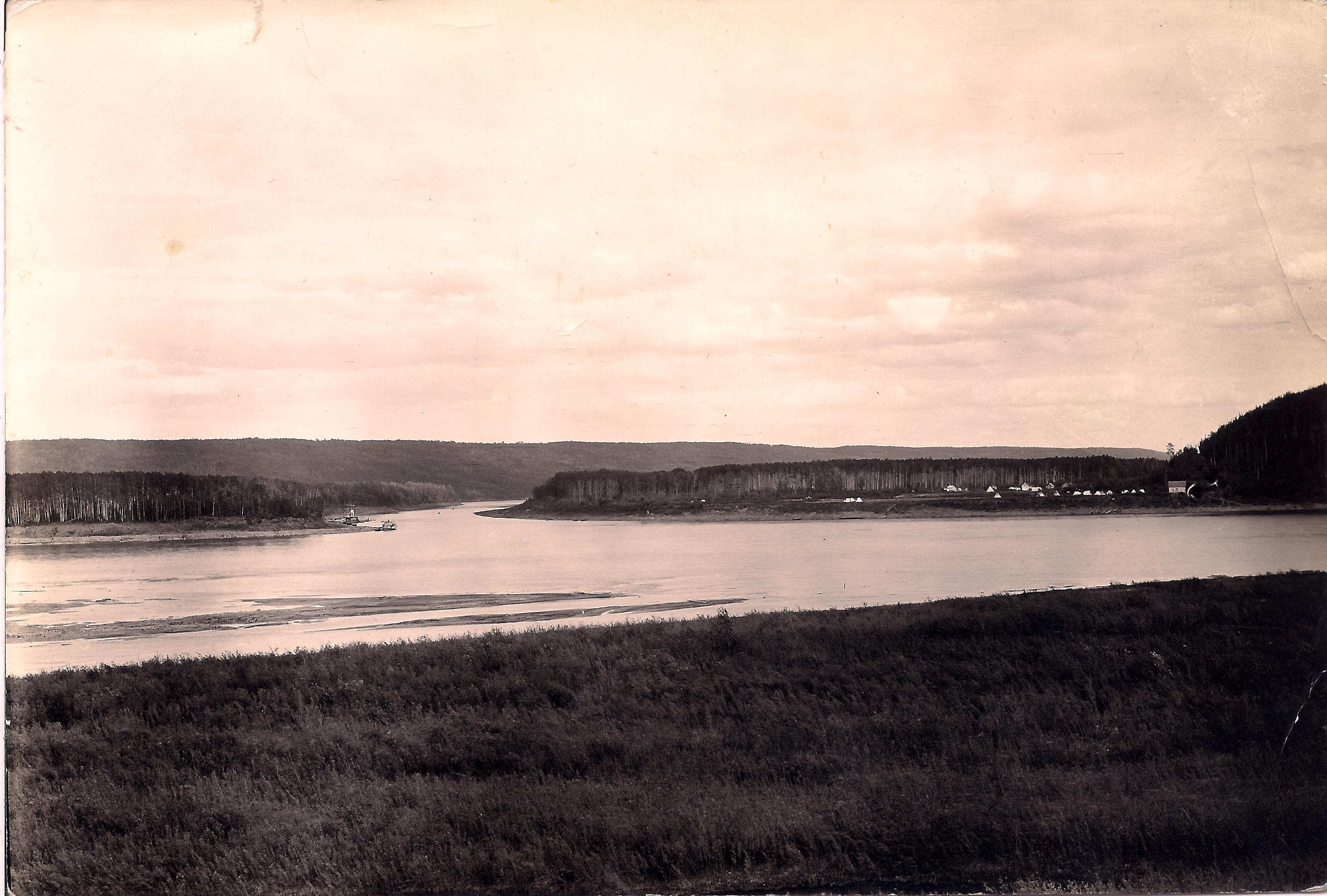 Fort McMurray, Alberta from the opposite side of the Athabasca River, 1911. From the Charles Eymundson fonds. Image via Wikimedia Commons.