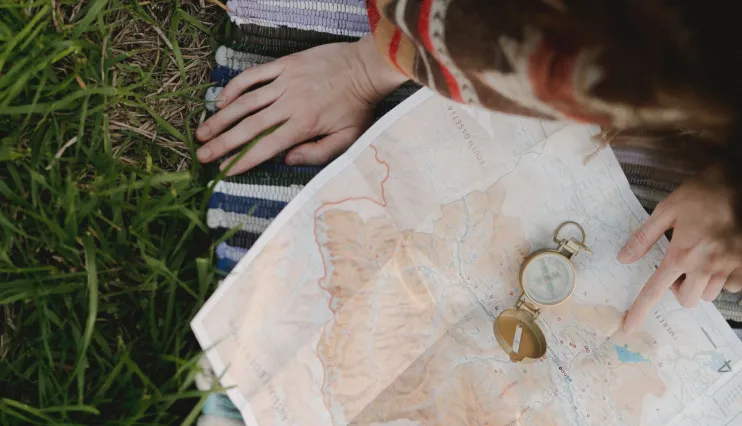 Person studying a map outdoors